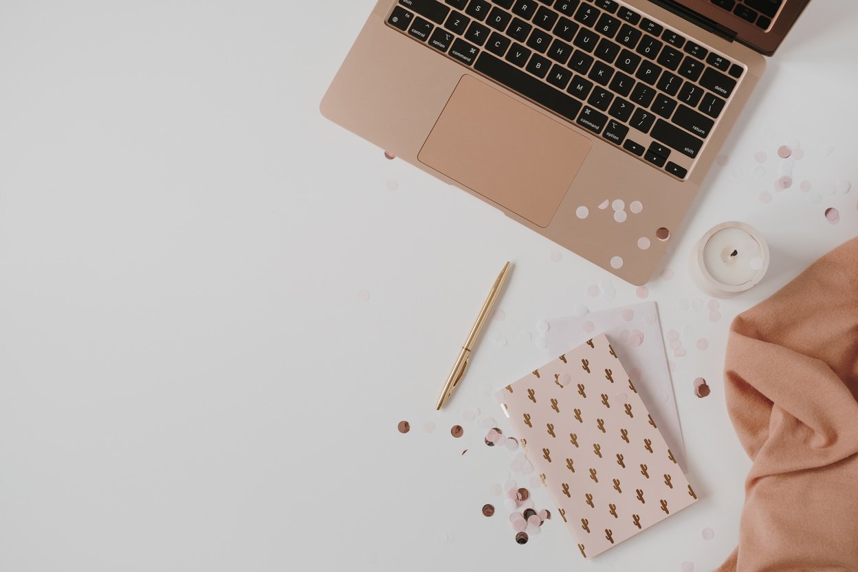 Laptop and Stationary on White Background